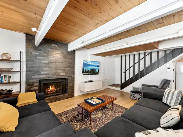 Living room with a fireplace at Patton's Pfeiffer Cabin