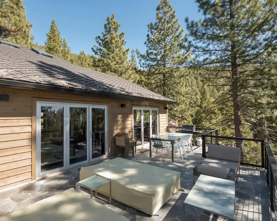 Two decks - one with an outdoor dining table, soft patio chairs, and bright lake views, Skylake Serenity Retreat, an MG home in Incline Village